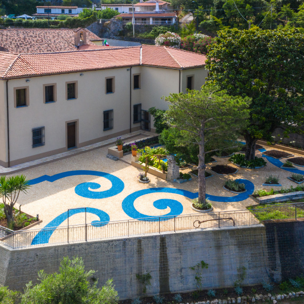 ItalianTerrazzo®, exposed aggregate paving giallo ocra and blu oltremare color. Giardino delle Arti, Maratea (Italy) Project Arch. Francesco Canestrini. 01